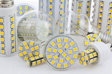 Various bulbs with 3-chip SMD LEDs next to tungsten bulb clipart