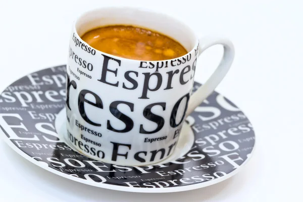Cup fresh espresso coffee with crema on the black saucer — Stock Photo, Image
