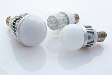 Different types of LED bulbs E27, 80mW older chips and new chips clipart