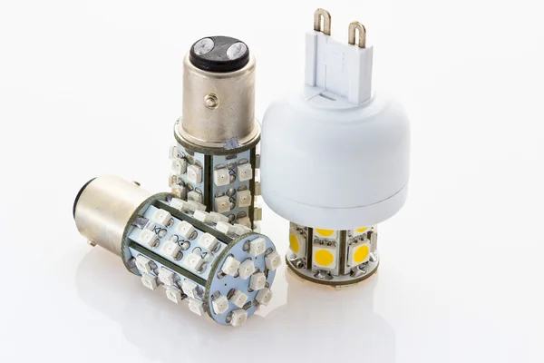 Due lampadine 12V LED con una baionetta e una lampadina 230V LED con G9 — Foto Stock