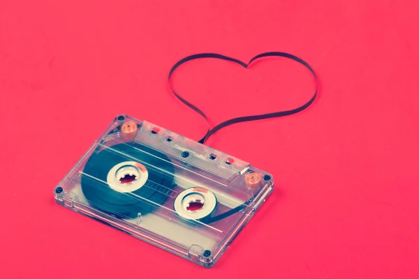 stock image Audio cassette with tape shaping a heart