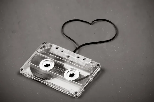 stock image Audio cassette with tape shaping a heart