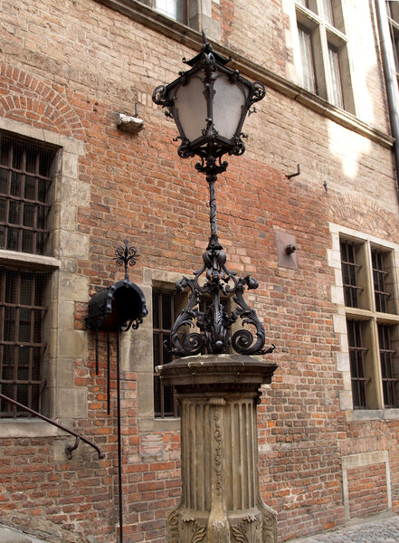 Decorative lamp on a wall of an old building in Gdansk, Poland