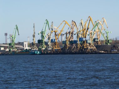 Lithuania Portal cranes in the Klaipeda seaport clipart