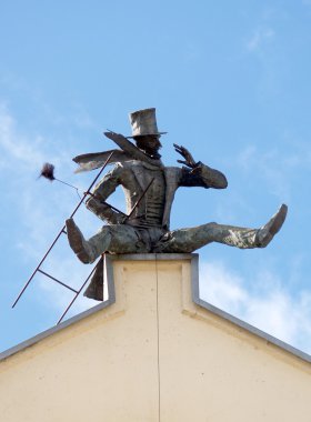 Monument to the chimney sweep in Klaipeda, Lithuania clipart