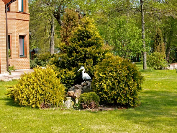 Landscaping with a heron figure — Stock Photo, Image