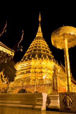 Golden pagoda of Wat Doi Suthep in night clipart