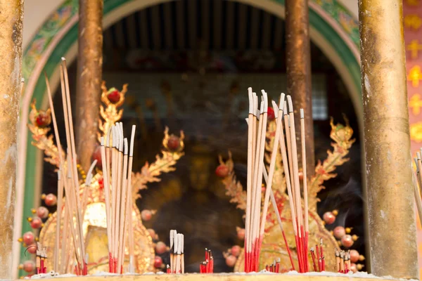 Burning incense in front of temple — Stock Photo, Image