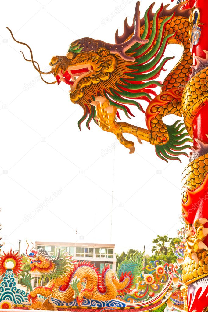 Golden dragon statue on pillar