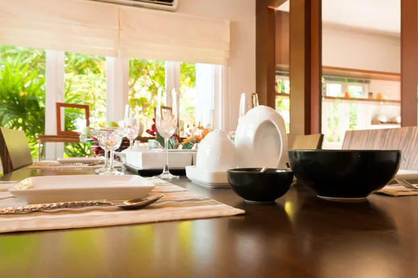 Set of kitchenware on dining table — Stock Photo, Image