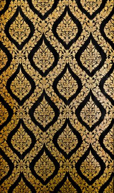 Golden Thai pattern on black wall clipart