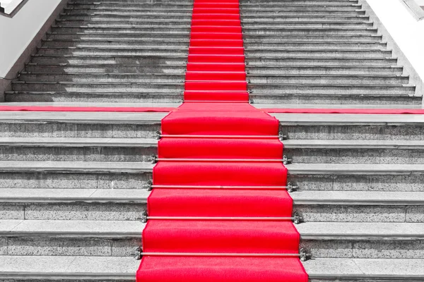 stock image Red carpet way on black and white staircase
