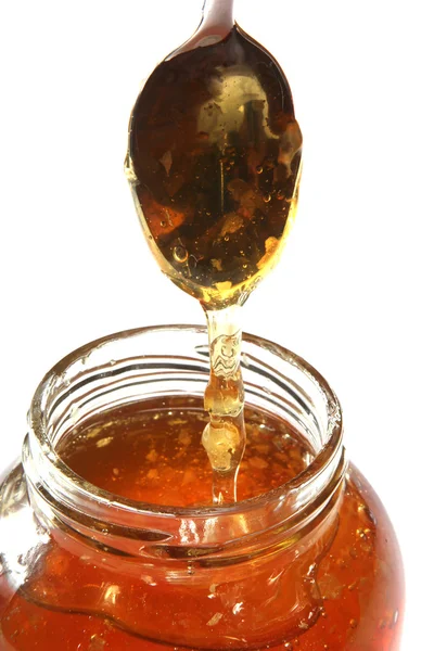 Ковш с медом — стоковое фото
