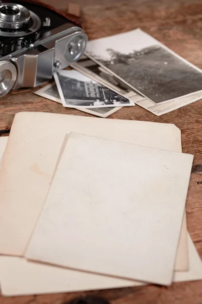 Vintage photos, paper and camera — Stock Photo, Image