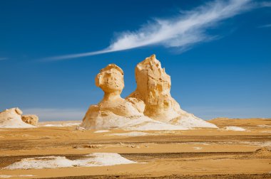 The limestone formation rocks looks like two sphinx in the Whit clipart