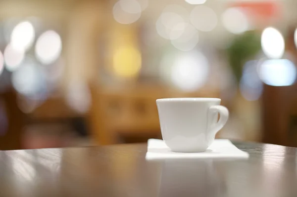 Espresso coffee in thick white cup in a cafe, super shallow dof — Stock Photo, Image