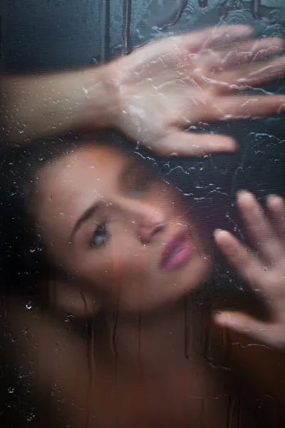 stock image Sensual girl behind the glass