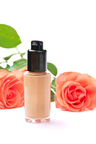 Natural cosmetics concept: foundation cream with roses, on white — Stock Photo, Image