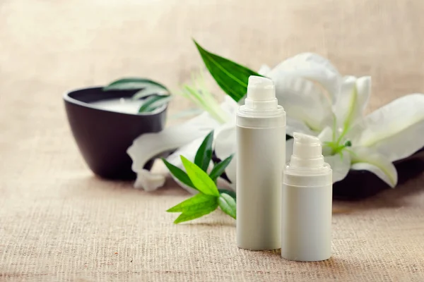 Face/body care concept: bottles of creams/lotions/serums with wh — Stock Photo, Image