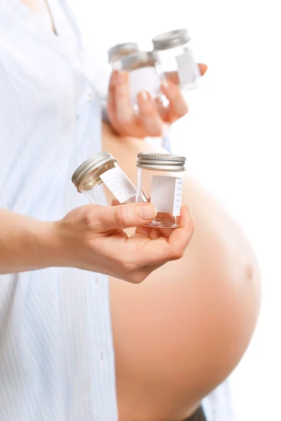 Pregnant woman with containers for giving urine samples, closeup — Stock Photo, Image