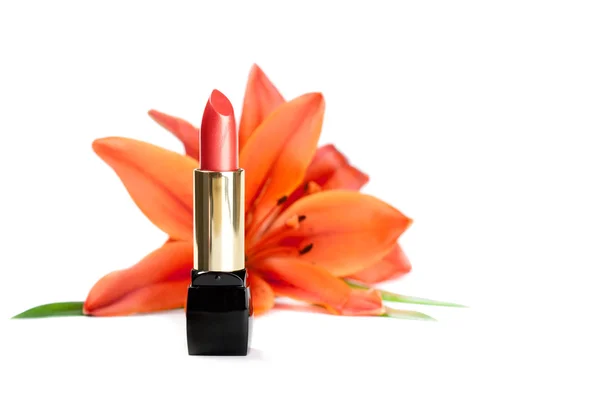 New lipstick and lily flowers, isolated on the white background — Stock Photo, Image