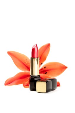 New lipstick and lily flowers, isolated on white background clipart