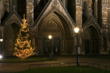 Christmas tree in front of Westminster Abbey in London England clipart