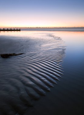 Beautiful low tide beach vibrant sunrise clipart