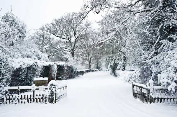 stock image Path through English rurual countryside in Winter with snow