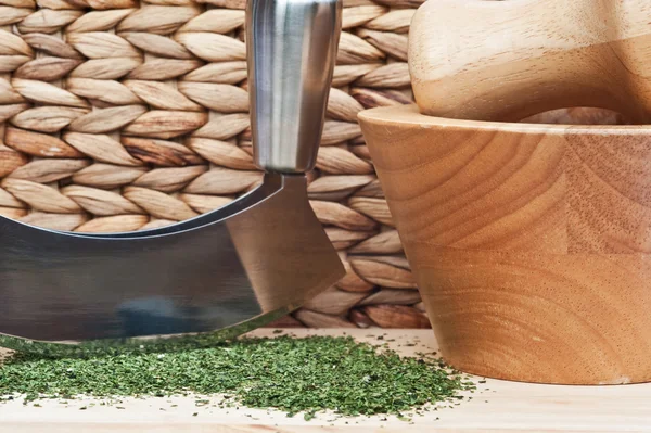 Chopped coriander cilantro leaves with herb chopper and pestle a — Stock Photo, Image