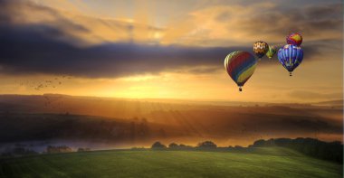 Stunning sunrise of hot air balloons over South Downs landscape clipart