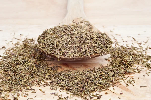 Thyme on wooden serving spoon with selective focus — Stock Photo, Image