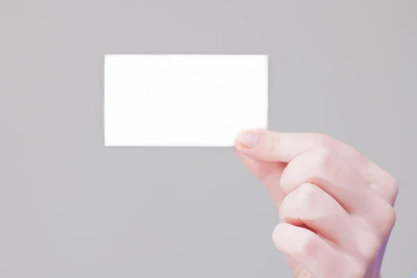 Arm hält Visitenkarte mit leerem Platz für Informationen und Logo — Stockfoto