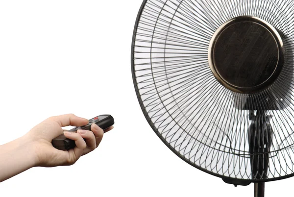 Fan and hand with remote control — Stock Photo, Image