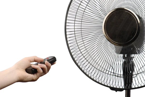 Ventilador y mano con mando a distancia —  Fotos de Stock