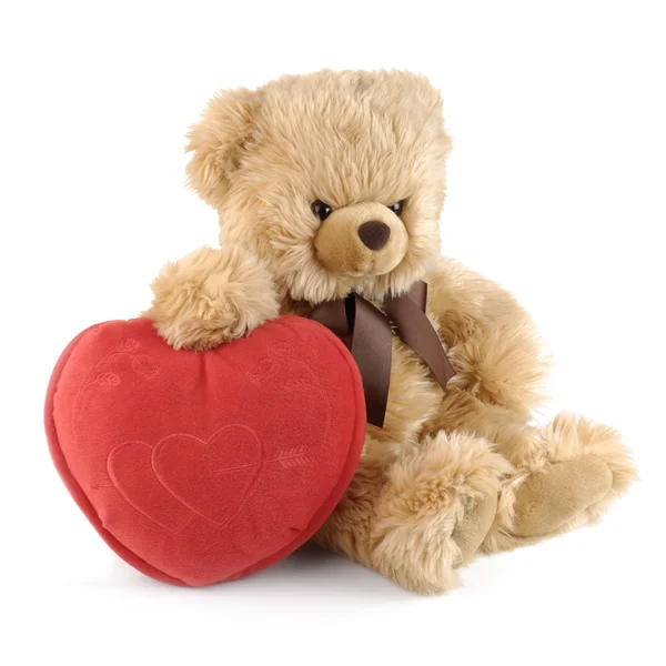Teddybär mit großem roten Herz Stockbild