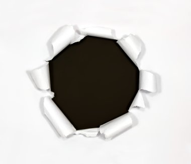 Round hole in paper on black background clipart