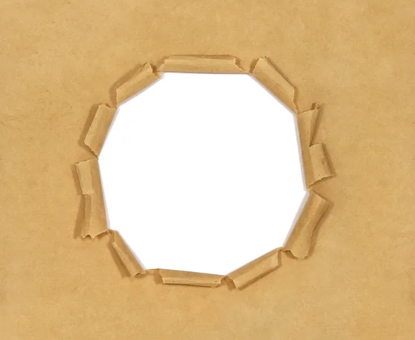 Eski kahverengi kağıt üzerinde beyaz izole deliği ile — Stok fotoğraf