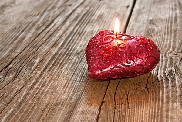 Red heart shaped candle — Stock Photo, Image