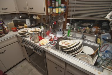 Dirty dishes piled up in sink