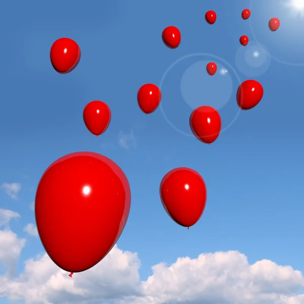 Balões vermelhos festivos no céu para a celebração — Fotografia de Stock
