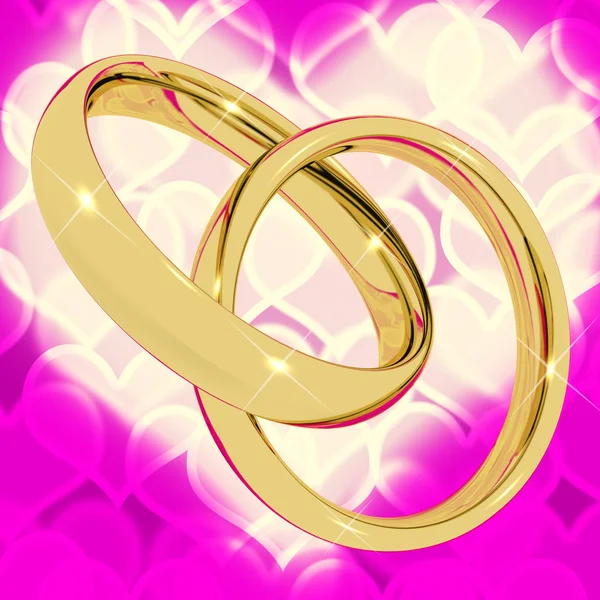 Goldringe auf rosa Herz-Bokeh-Hintergrund, der Love Vale darstellt — Stockfoto