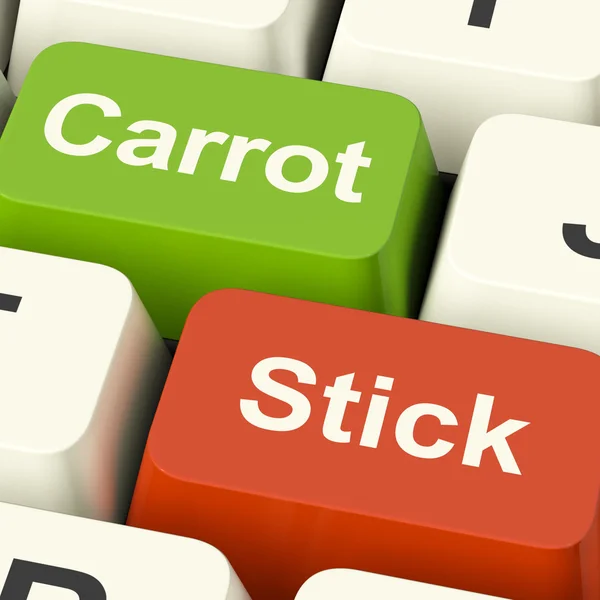 Морква або Стік-ключі, що показують мотивацію за стимулом або тиском — стокове фото