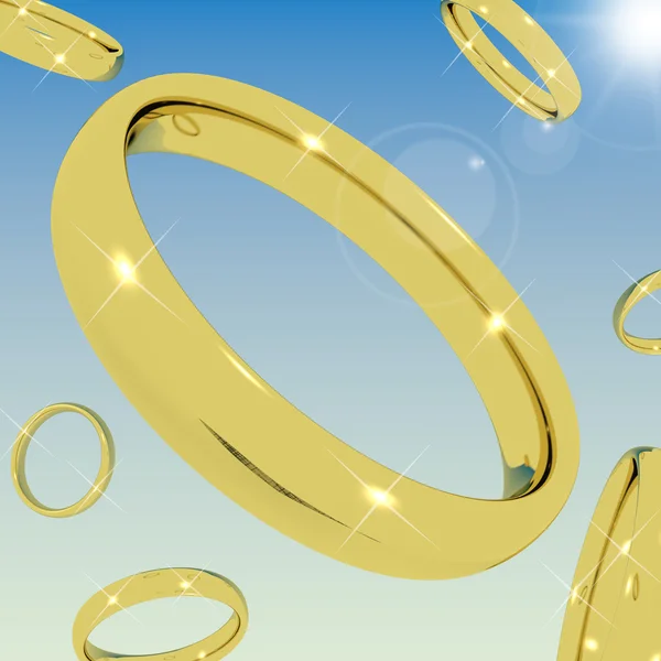 Gold Rings Falling From the Sky Representing Love Engagement Or — Stock Photo, Image