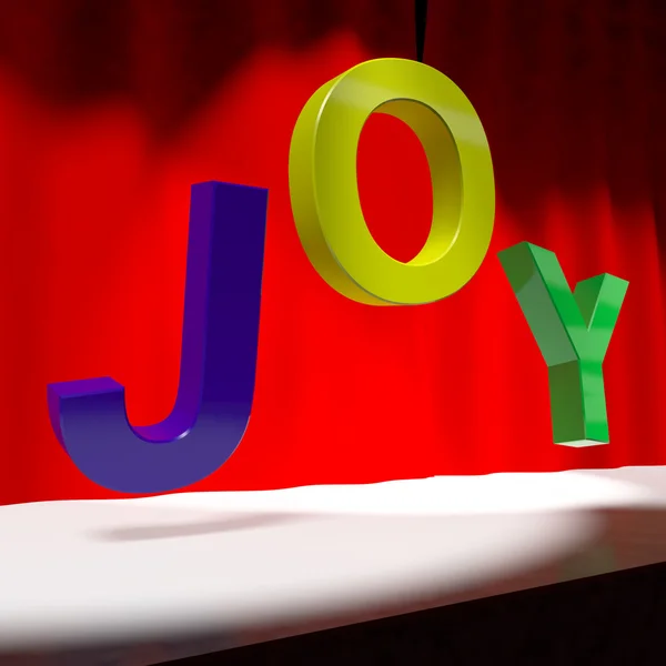 Słowo radość na scenie jako symbol dla zabawy i przyjemności działających — Zdjęcie stockowe