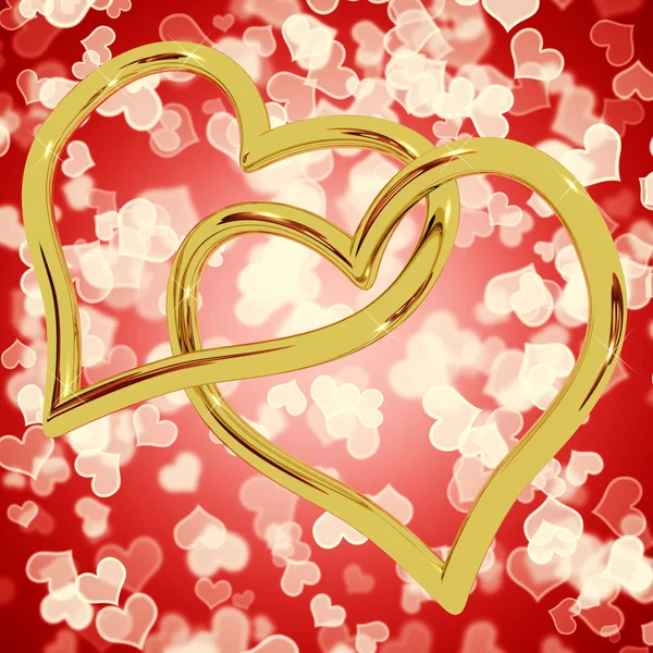 Złote serce w kształcie pierścieni na czerwony bokeh reprezentujących miłości i roman — Zdjęcie stockowe