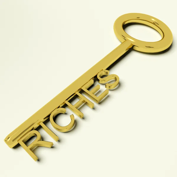 Riquezas chave representando riqueza e fortuna — Fotografia de Stock