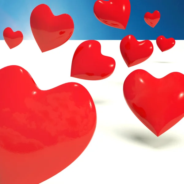 Fallende Herzen, die Liebe und Verehrung symbolisieren — Stockfoto