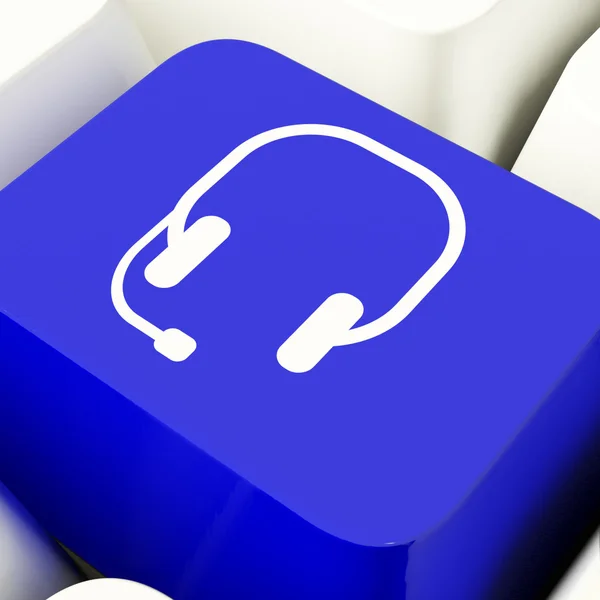 耳机符号的计算机密钥以蓝色显示沟通和在线 — 图库照片
