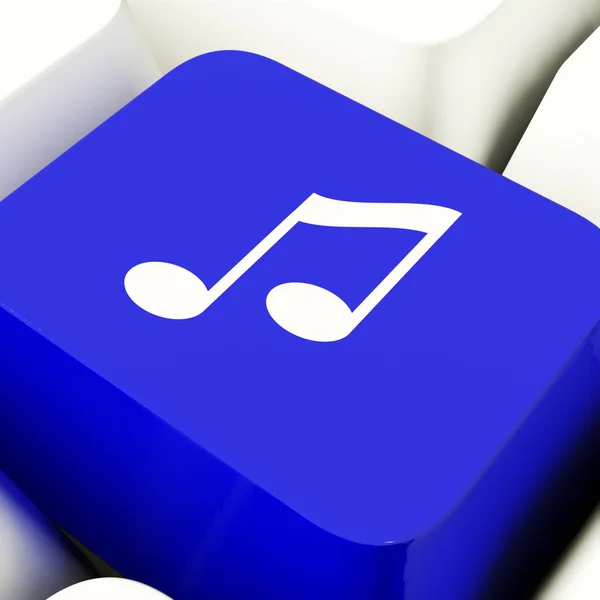 Clé d'ordinateur de symbole de musique en bleu montrant la radio ou l'audio en ligne — Photo